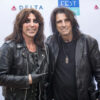 Alice Cooper posing in front of a step and repeat at Fest Forward.
