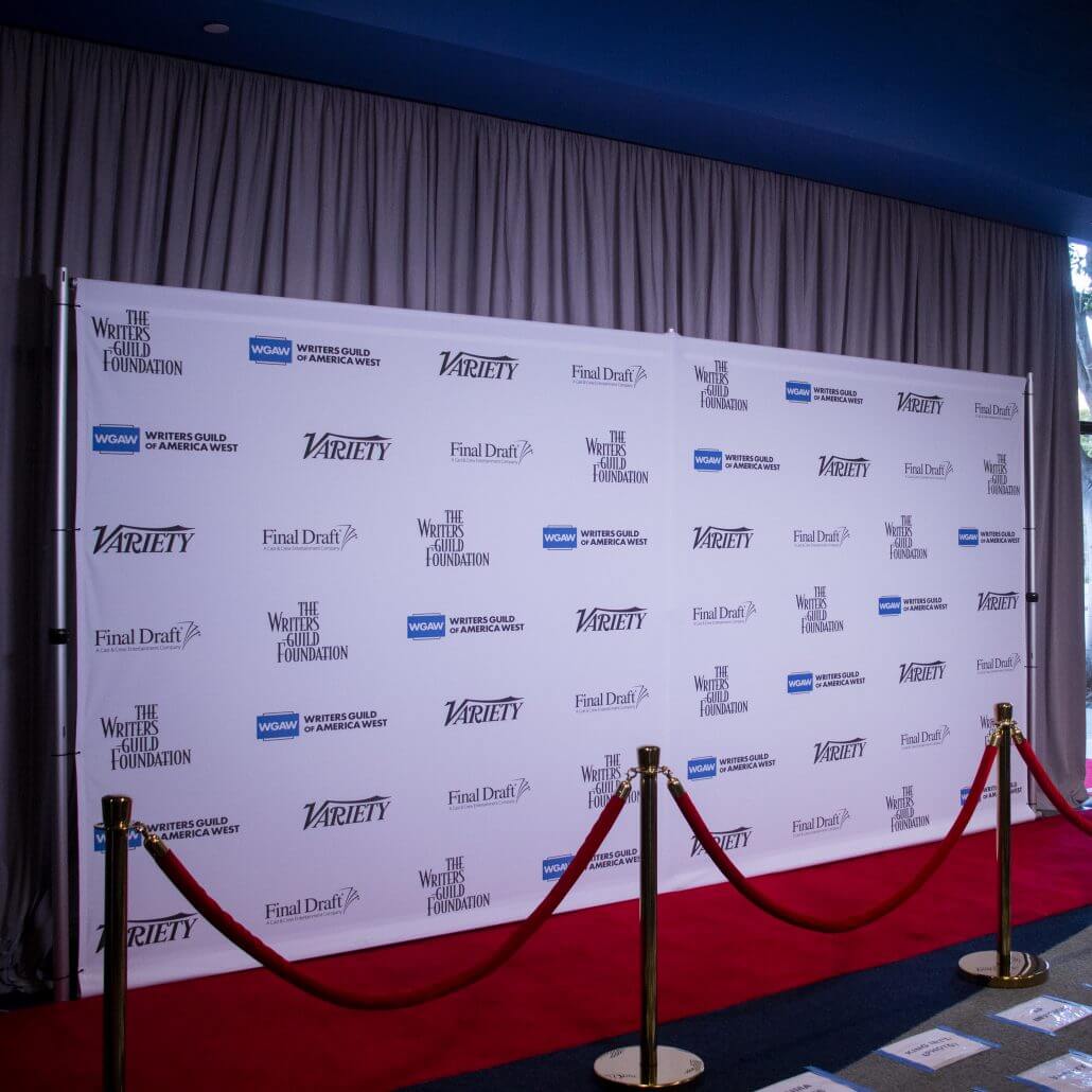8' x 16' backdrop, pipe and base stand, stanchions, rope and red carpet for The Writers Guild Foundation.