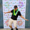 A Hawaiian style backdrop and leis for your customer photos!