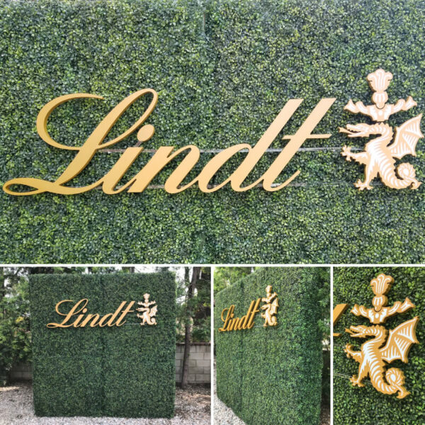 A Hedge Wall with a custom cutout logo