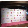 An 8 by 16 foot fabric step and repeat backdrop