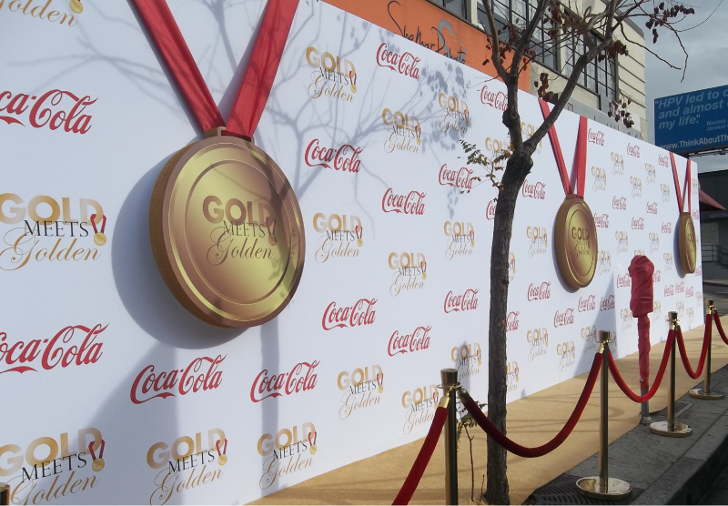 We fabricated these custom gold 3-D metals with red ribbon for the Gold meets Golden event.